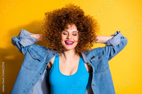 Close-up portrait of nice cute lovely charming attractive winsome sweet glamorous cheerful optimistic wavy-haired girl having rest free time isolated over bright vivid shine yellow background