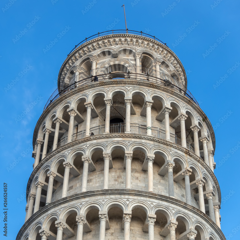 PISA, TUSCANY/ITALY  - APRIL 17 : Exterior view of the Leaning Tower of Pisa Tuscany Italy on April 17, 2019. Three unidentified people