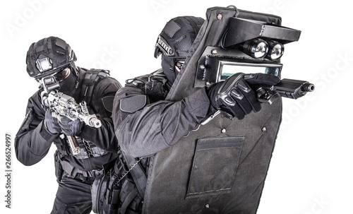 Fotografija SWAT team behind ballistic shield studio shoot