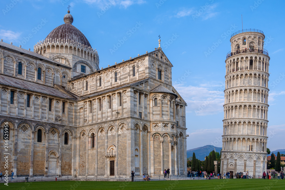 PISA, TUSCANY/ITALY  - APRIL 17 : Exterior view of the Cathedral and Leaning Tower in Pisa Tuscany Italy on April 17, 2019. Unidentified people
