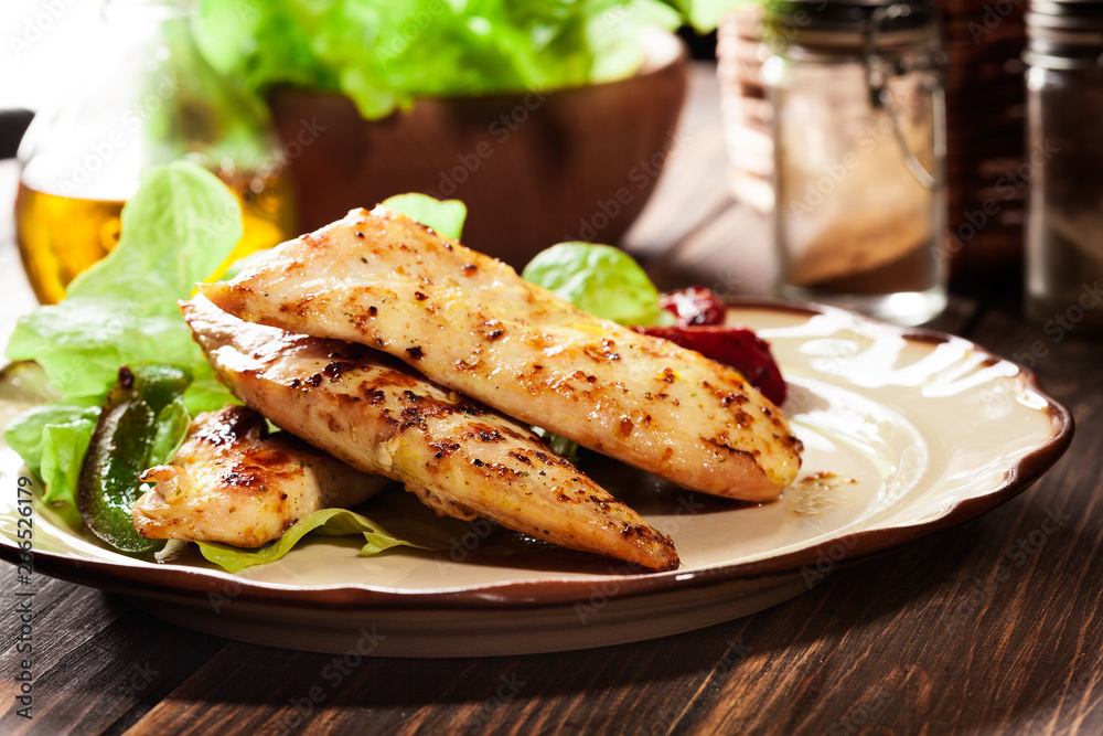 Grilled chicken breasts served with grilled paprika Grilled chicken breasts served with grilled paprika