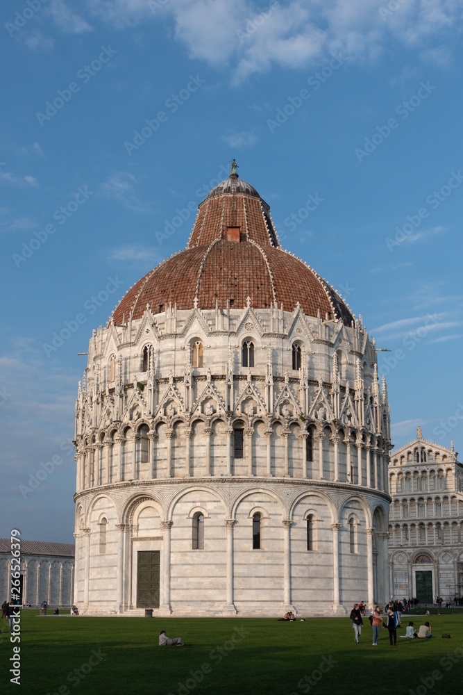 PISA, TUSCANY/ITALY  - APRIL 17 : Exterior view of the Baptistery in Pisa Tuscany Italy on April 17, 2019. Unidentified people