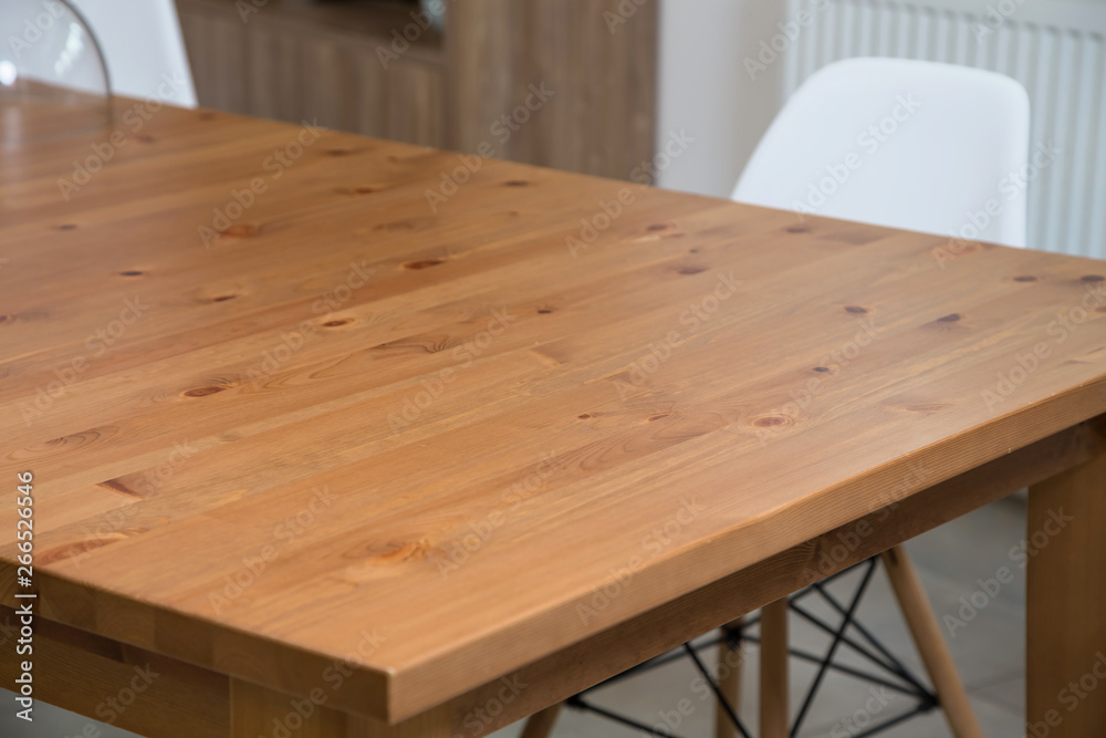 Massive kitchen table with chairs in the interior. Close up. Massive kitchen table with chairs in the interior. Close up.