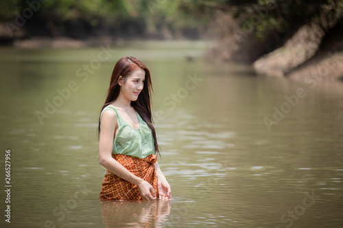 Fototapeta Naklejka Na Ścianę i Meble -  Beautiful women bathing in the rivers at the countryside.