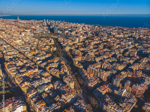 Aerial view of Barcelona Eixample residencial district, Sagrada familia, typical urban squares, Spain.2019