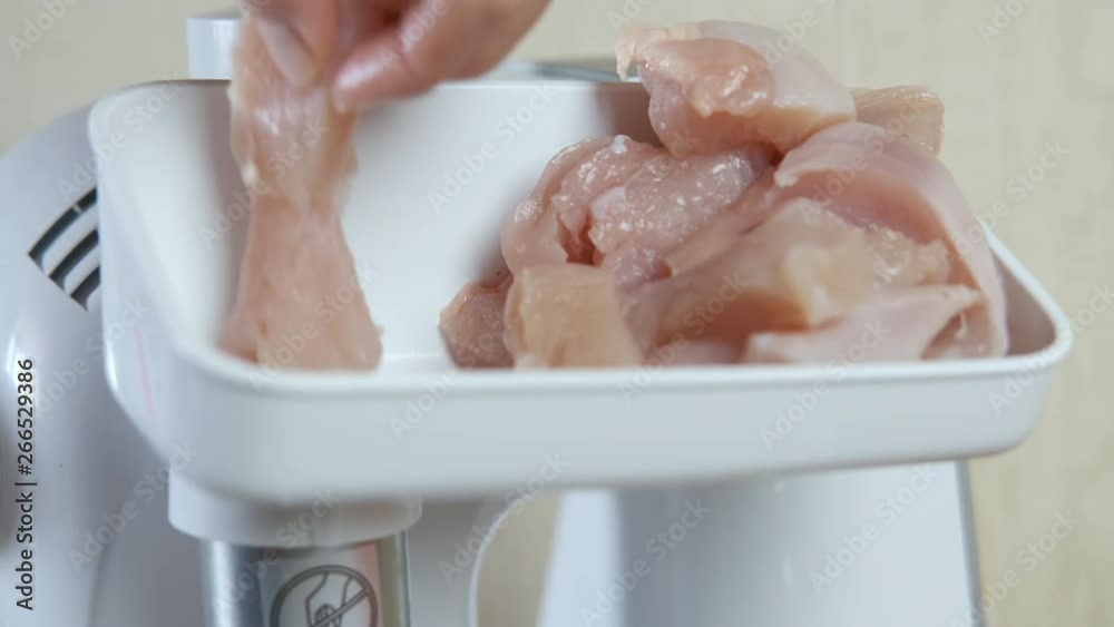 Chopped meat. Chicken meat is ground in a household meat grinder. Chopped meat. Chicken meat is ground in a household meat grinder.