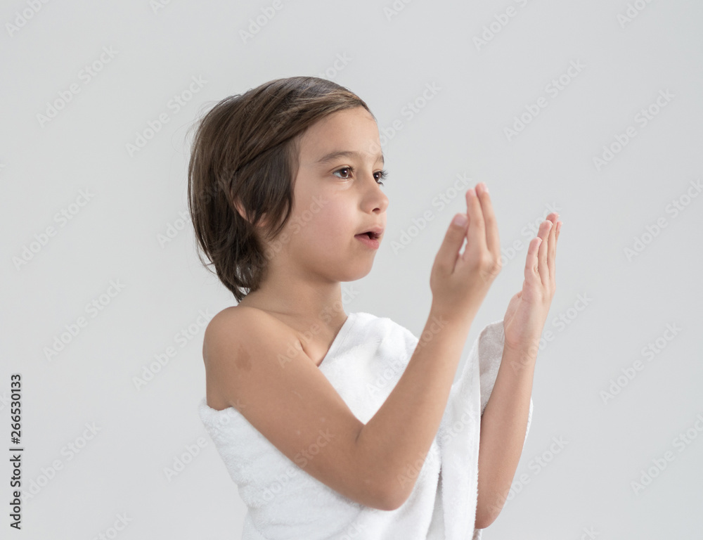 Child with Hajj pilgrimage clothes praying Child with Hajj pilgrimage clothes praying