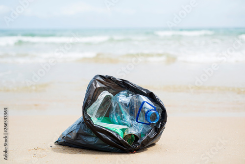 garbage bag on the beach © nito