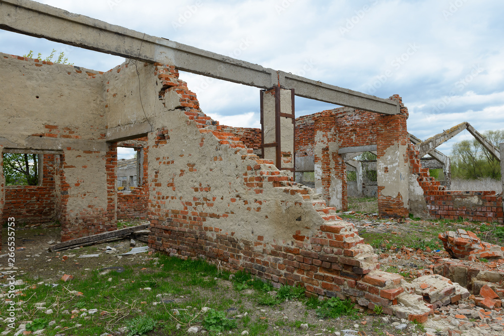 old destroyed brick walls of abandoned buildings on a cloudy spring day old destroyed brick walls of abandoned buildings on a cloudy spring day