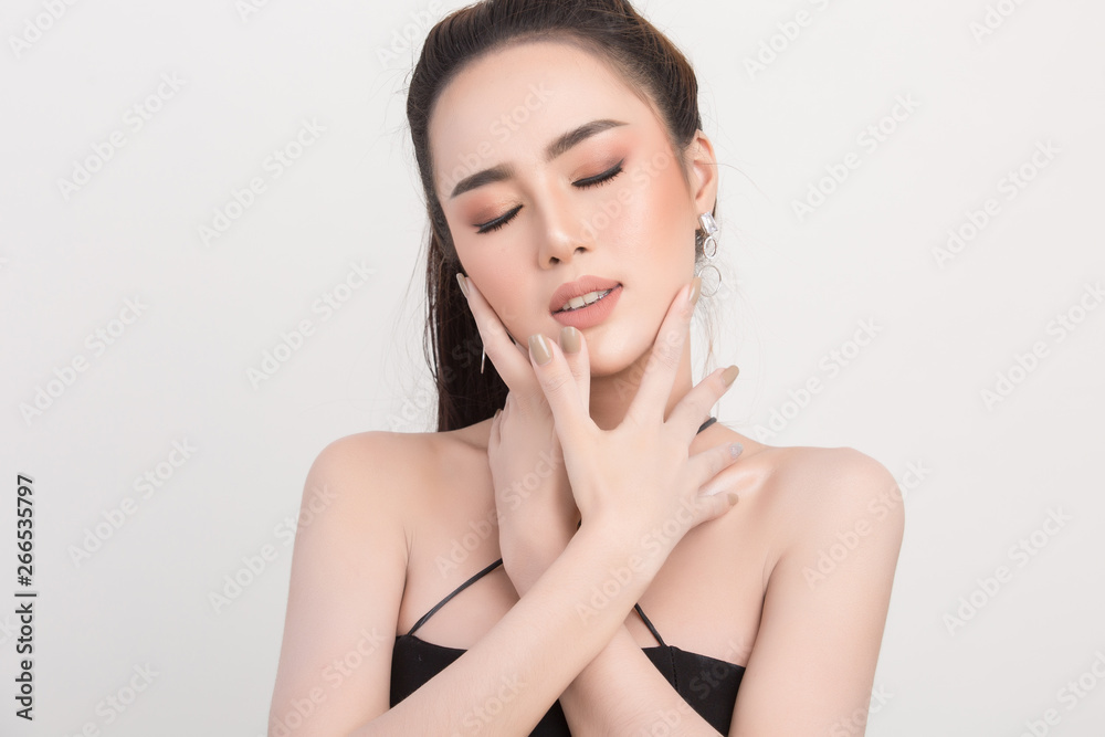 Beautiful woman face. Hand of make-up Beautiful woman face. Hand of make-up