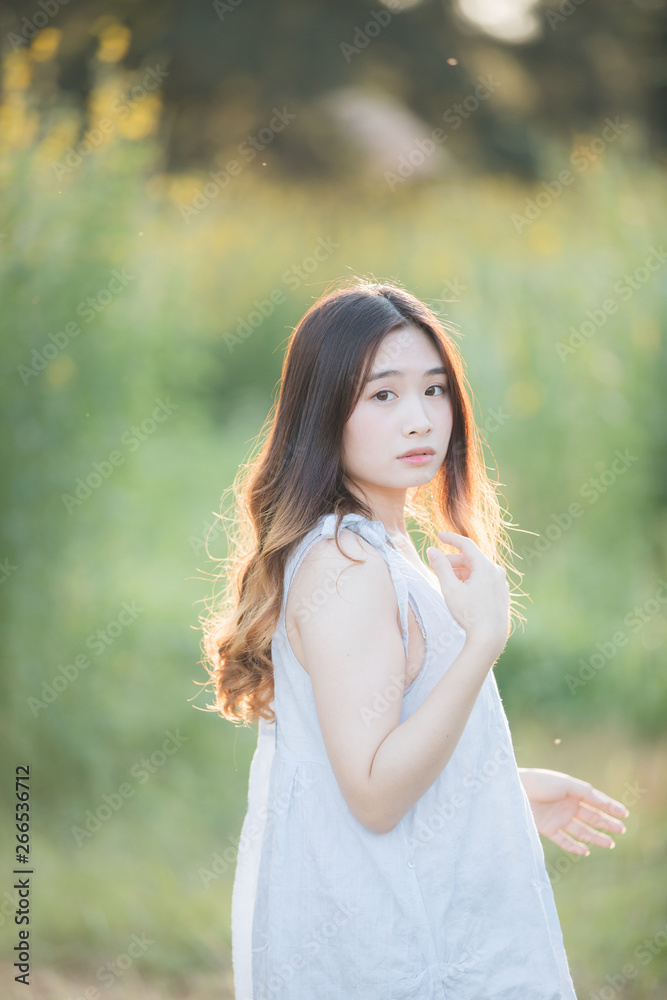 Portrait of Young Asian woman girl smile in flower garden Portrait of Young Asian woman girl smile in flower garden