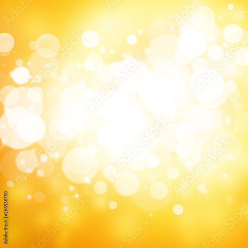 Gold sparkle rays lights with bokeh elegant abstract background. Dust sparks background.