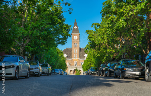 Historic Washington County Courthouse building in Fayetteville Arkansas, college ave, street view traffic, sunny summer day view