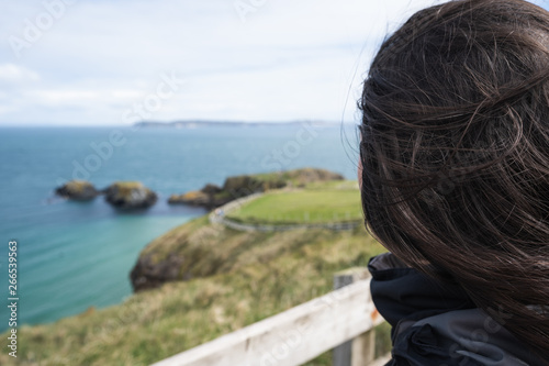 A woman enjoying a view at the sea