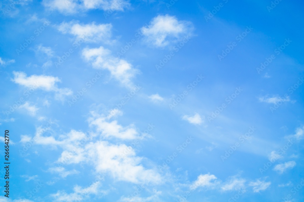 Blue sky with delicate white clouds. Sky background