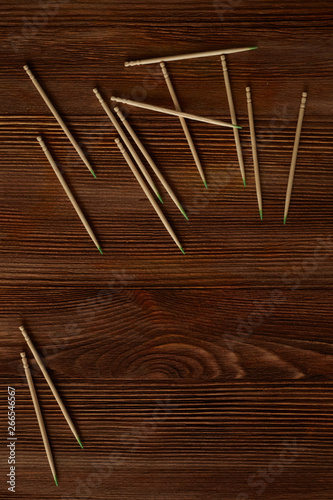 Toothpicks are loose on a wooden table
