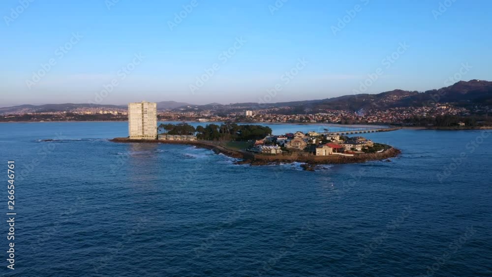 Aerial dolly backwards of beautiful sunset in Toralla private island in Vigo, Spain Aerial dolly backwards of beautiful sunset in Toralla private island in Vigo, Spain