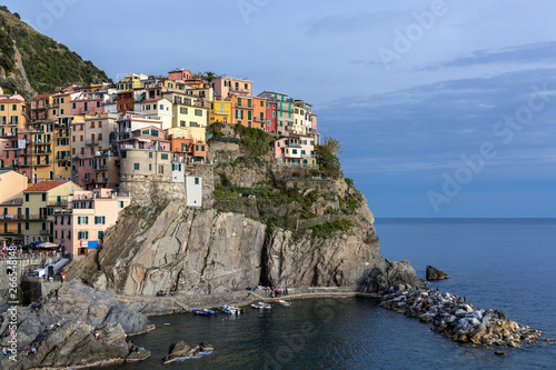 MANAROLA, LIGURIA/ITALY  - APRIL 21 : Coastal view at dusk of Manarola Liguria Italy on April 21, 2019. Unidentified people