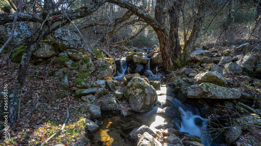 small waterfall in a river near madrid