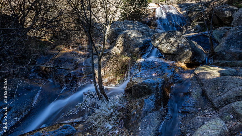 small waterfall in a river near madrid