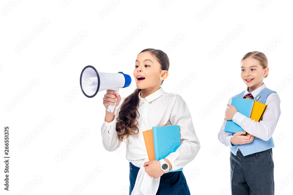 schoolgirls in formal wear holding books and shouting in mouthpiece Isolated On White schoolgirls in formal wear holding books and shouting in mouthpiece Isolated On White
