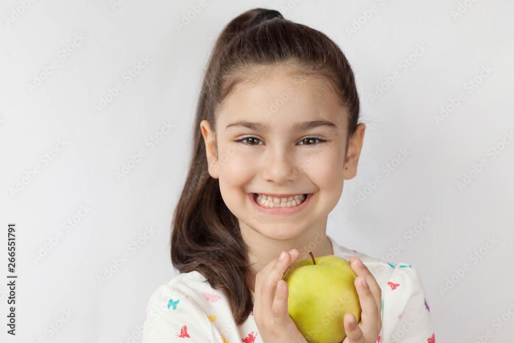 Happy adorable child girl with apple. Smile, healthy teeth, dentistry. Happy adorable child girl with apple. Smile, healthy teeth, dentistry.