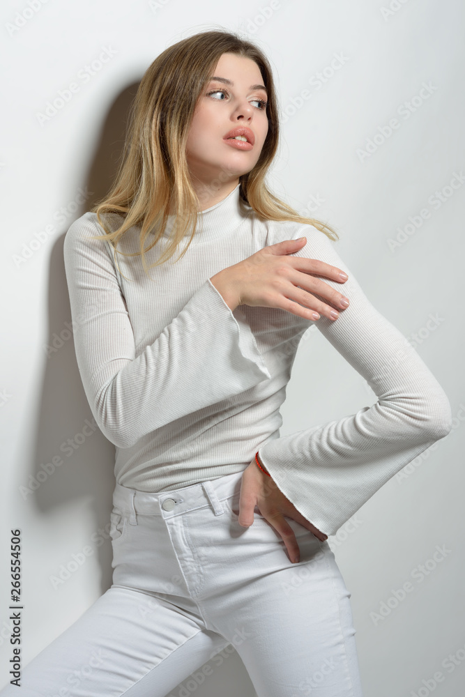 sexy beautiful woman in white clothes posing in studio with white background. sexy beautiful woman in white clothes posing in studio with white background.