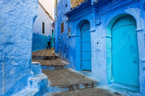Chefchaouen, Morocco : A child walks in the blue-washed alleyways of the medina old town.