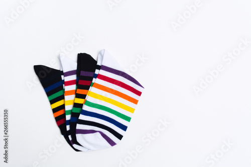 New striped colorful socks for feet. Clothes shopping concept on white background. Black and white socks with striped pattern