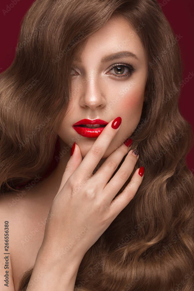 Beautiful girl with a classic makeup, curls hair and red nails. Manicure design. Beauty face. Beautiful girl with a classic makeup, curls hair and red nails. Manicure design. Beauty face.