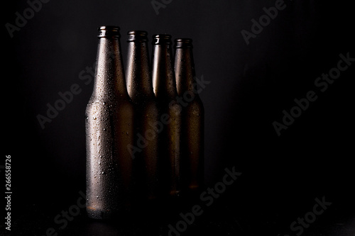 Line of black beer bottles