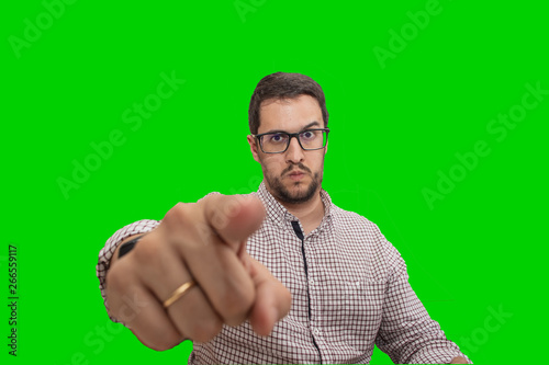 Young man with glasses, pointing with his finger