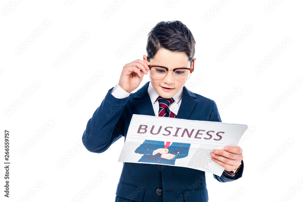 schoolboy in formal wear and glasses reading business newspaper Isolated On White schoolboy in formal wear and glasses reading business newspaper Isolated On White