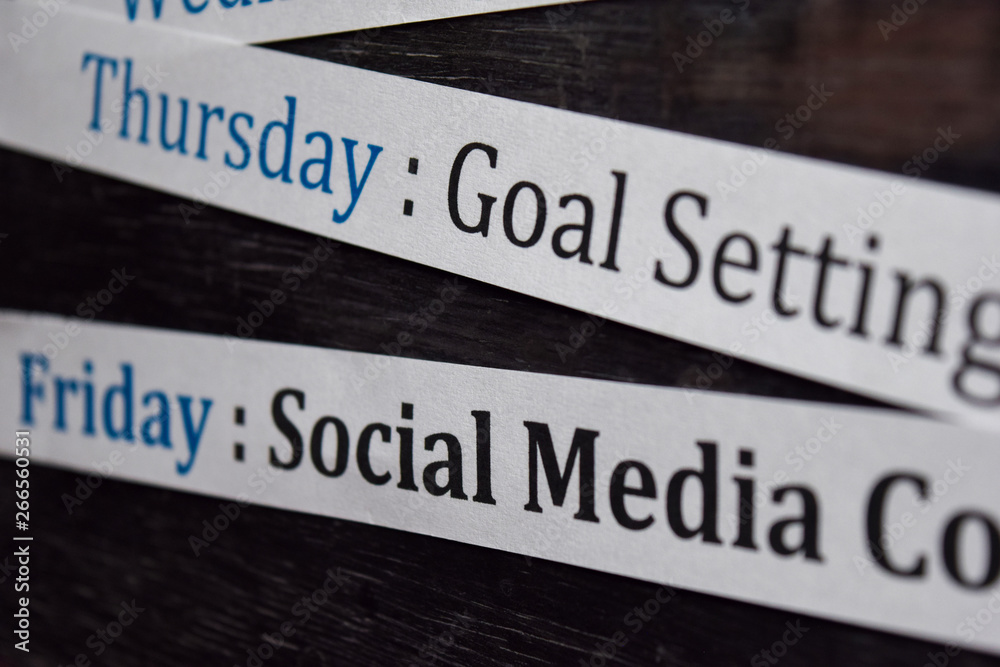 Close up making agenda weekly schedule on personal organizer. Business and entrepreneur concept. Isolated on blackboard Close up making agenda weekly schedule on personal organizer. Business and entrepreneur concept. Isolated on blackboard
