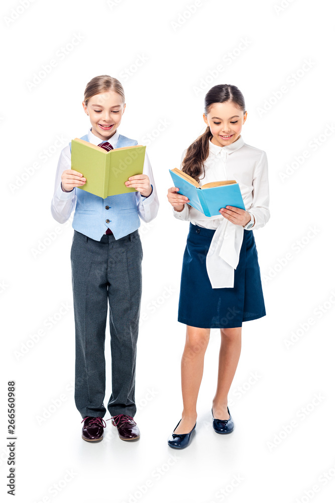 smiling schoolgirls in formal wear reading books On White smiling schoolgirls in formal wear reading books On White