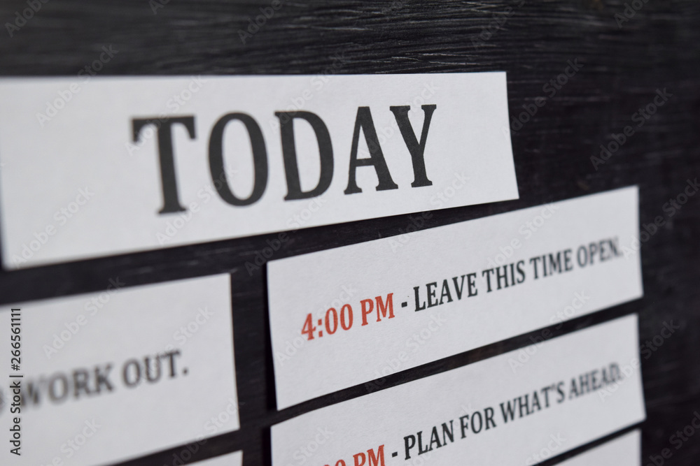 Close up making agenda Daily schedule on personal organizer. Business and entrepreneur concept. Isolated on black background Close up making agenda Daily schedule on personal organizer. Business and entrepreneur concept. Isolated on black background