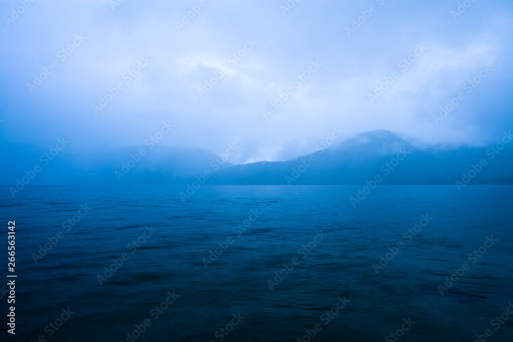 Clouds mist over Caburga lake, southern Chile, Araucania Region, Chile, South America