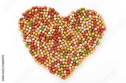 dry pet food in the shape of a heart shape isolated on white background