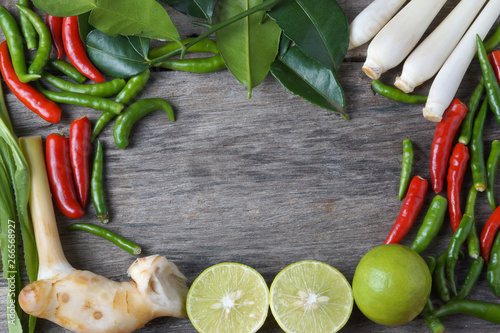 op view Chili  lemongrass Galangal lemon Lime leaves Ingredients For Cooking  Tom Yum  Chili Hot Spicy Soup Thai Popular Famous Food on wooden background