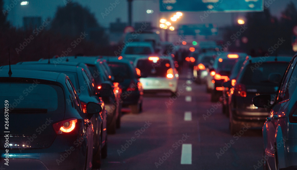 Traffic jam cars in row dusk night