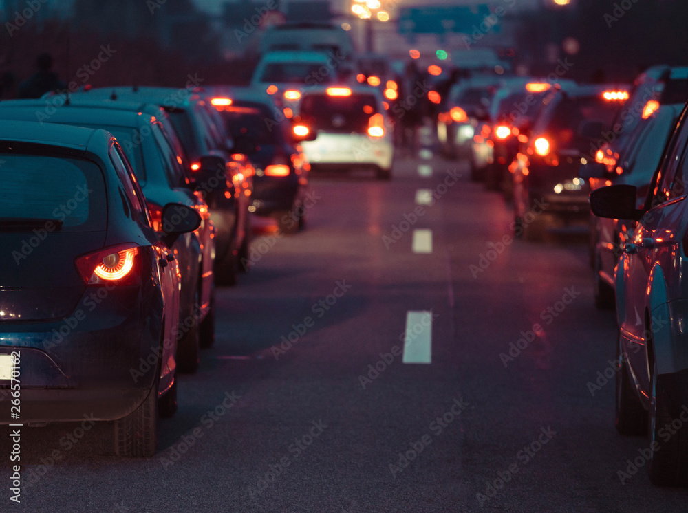 Traffic jam cars in row dusk night