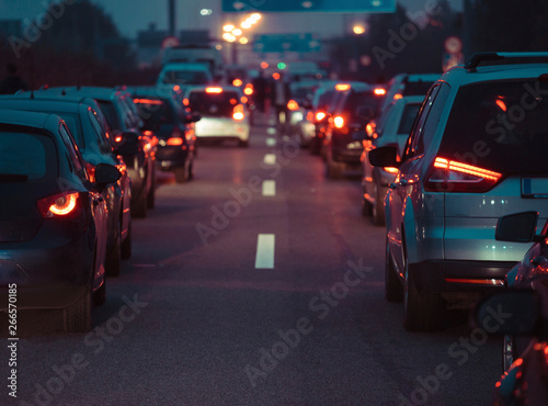 Traffic jam cars in row dusk night