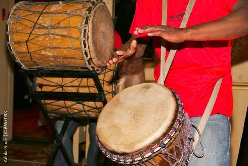 men playing drums with red shirts