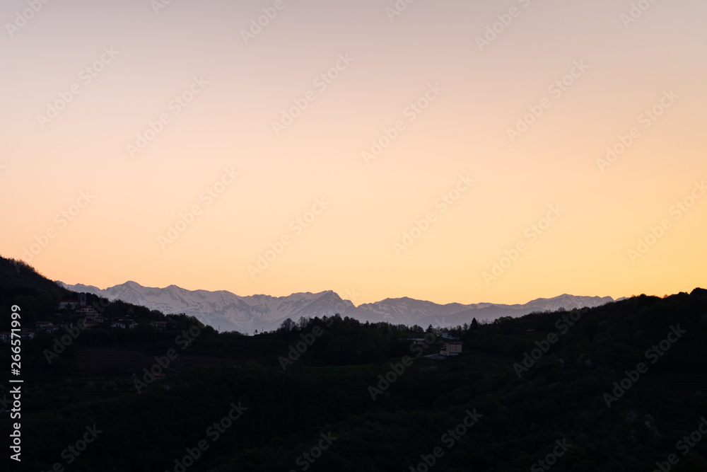 Sunrise over Brda vineyard hills and mountain Triglav in Slovenia