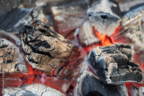 Smoldering lump of coal background  close up