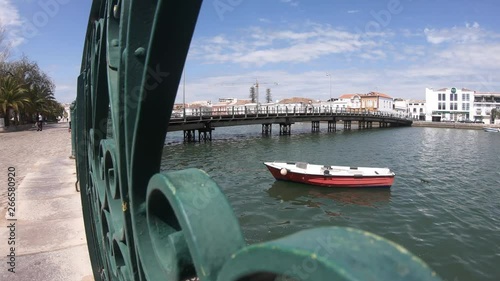 Fixed shot of the Roman bridge over the  Gilao River. Tavira, ALgarve, Portugal.