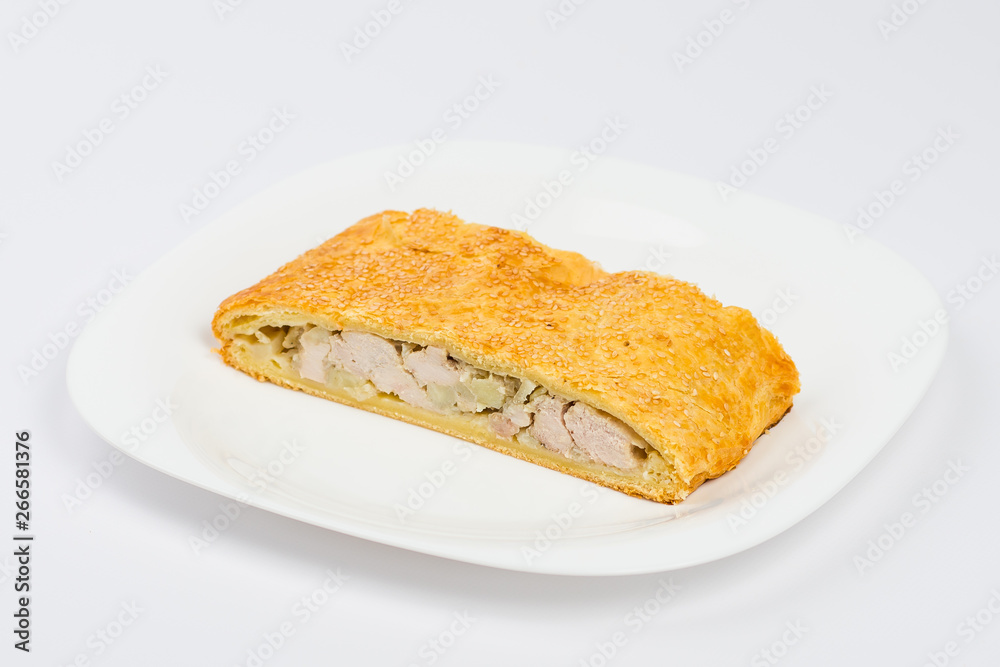 slice of chicken pie on a plate isolated on white slice of chicken pie on a plate isolated on white