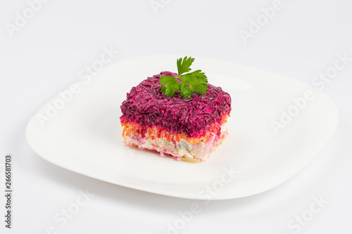 russian salad shuba on plate photo