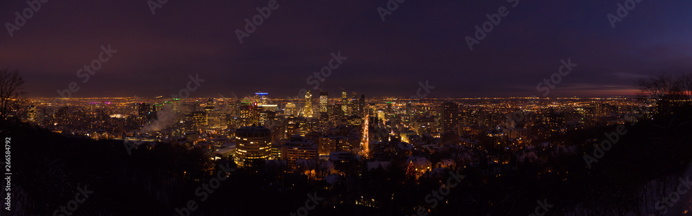 Downtown Montreal city lights at dusk in winter, panorama