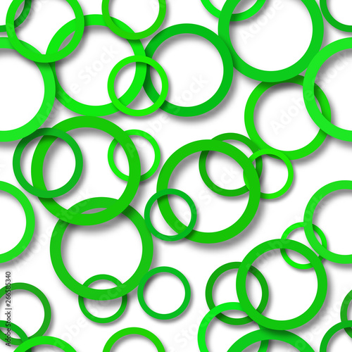 Abstract seamless pattern of randomly arranged green rings with soft shadows on white background